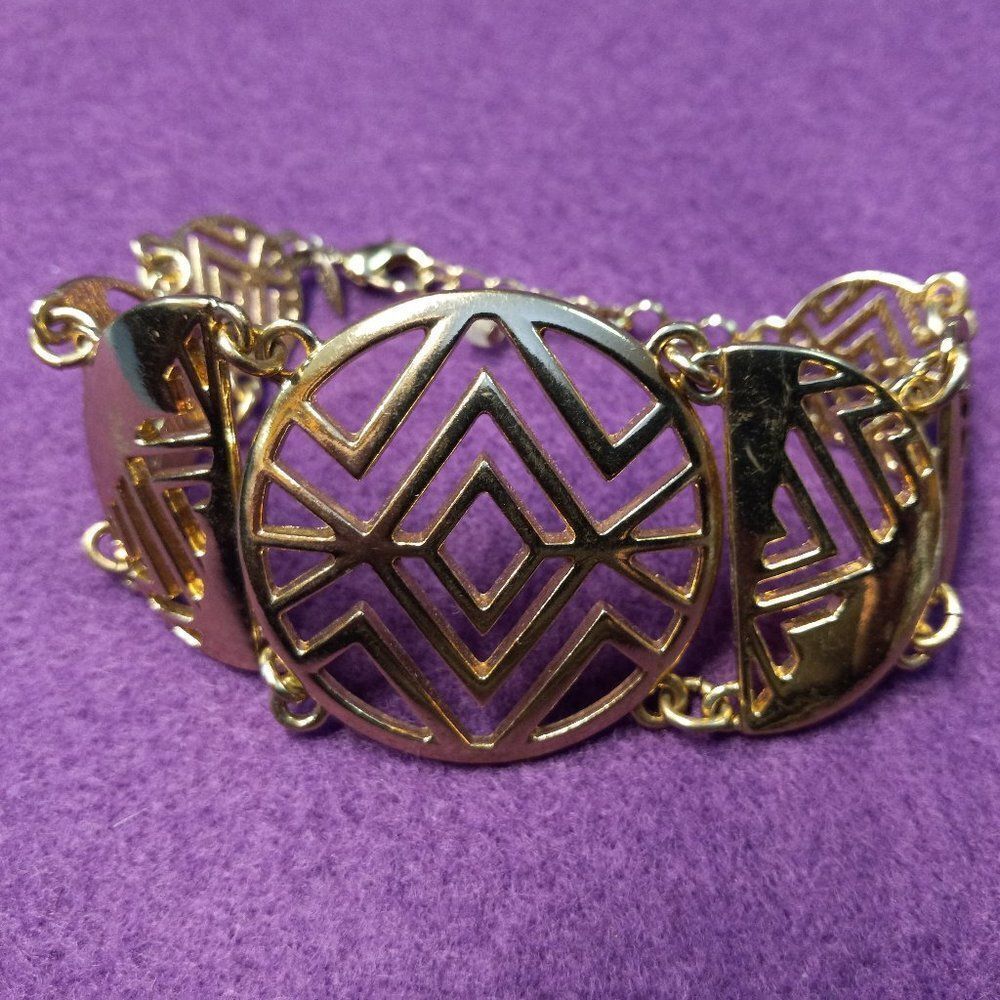 SHA Gold tone linked Bracelet